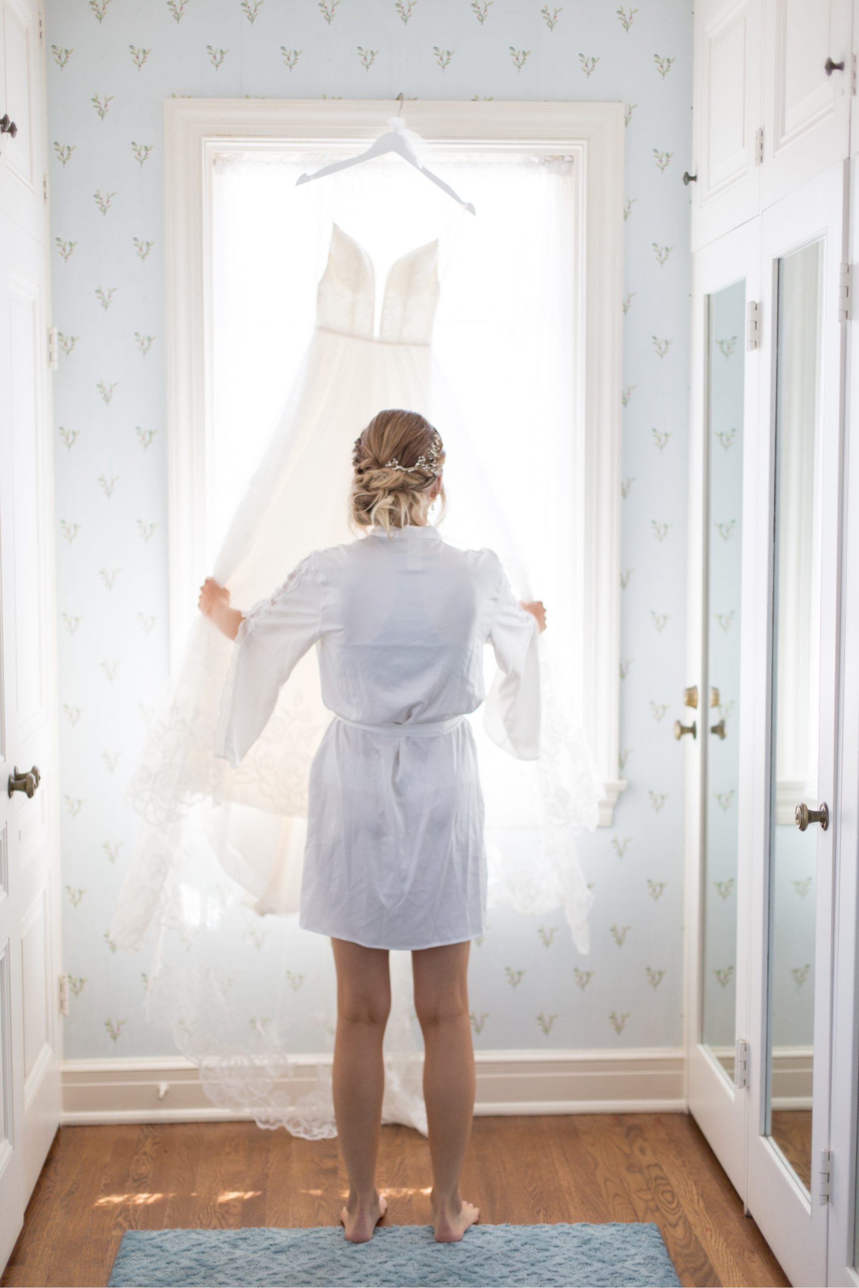 bride looking at her wedding dress