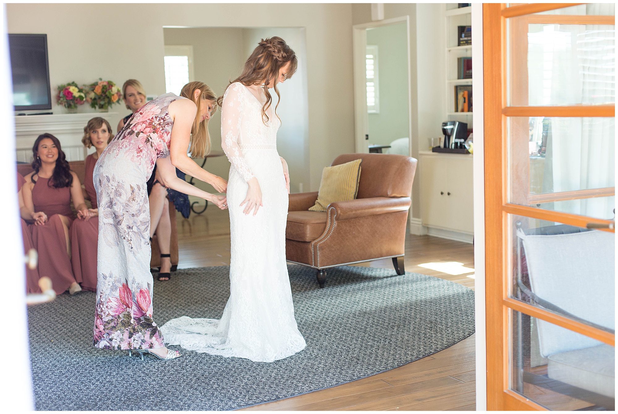 bride getting into her wedding dress