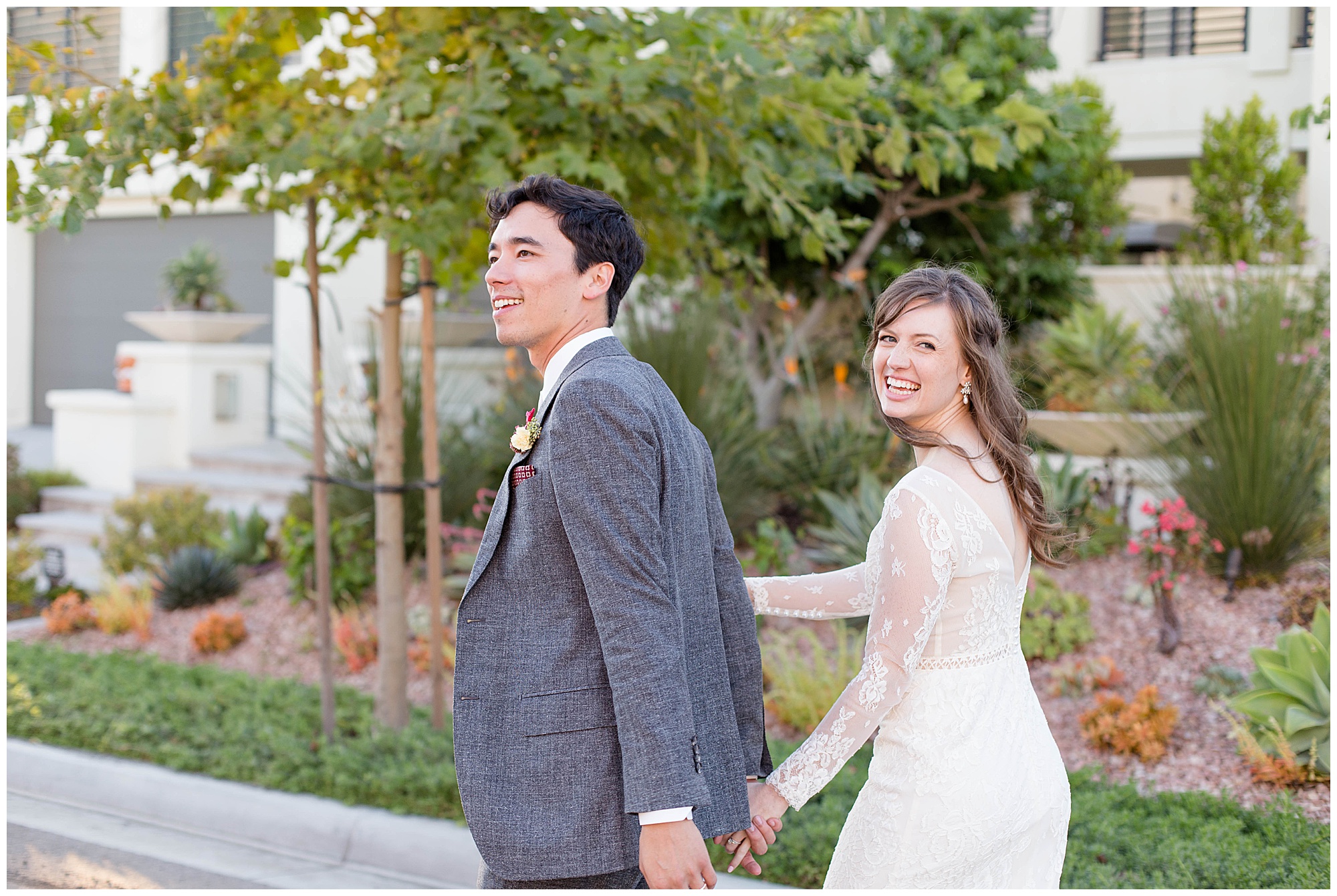 bride and groom walking down the street