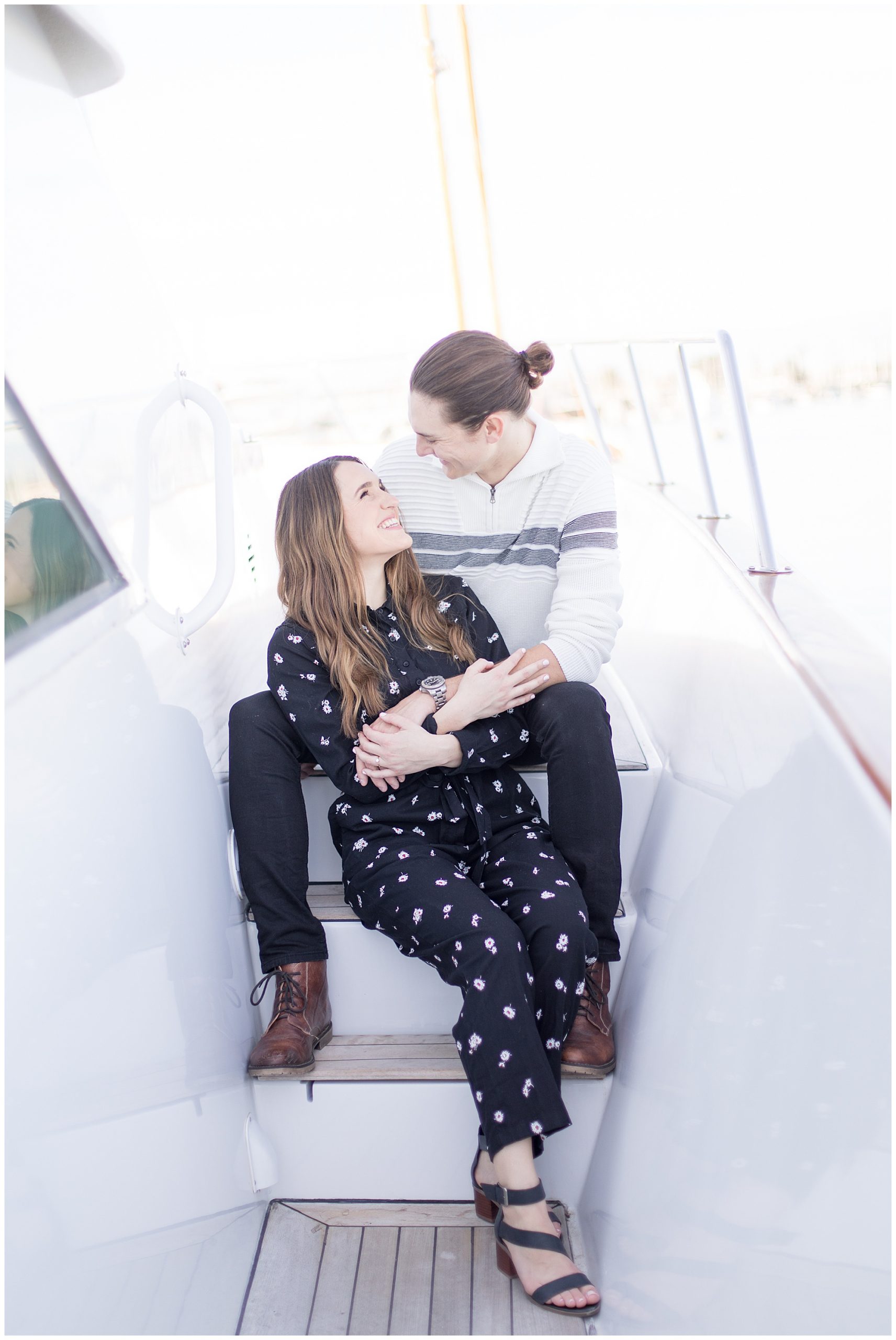 engaged couple on yacht