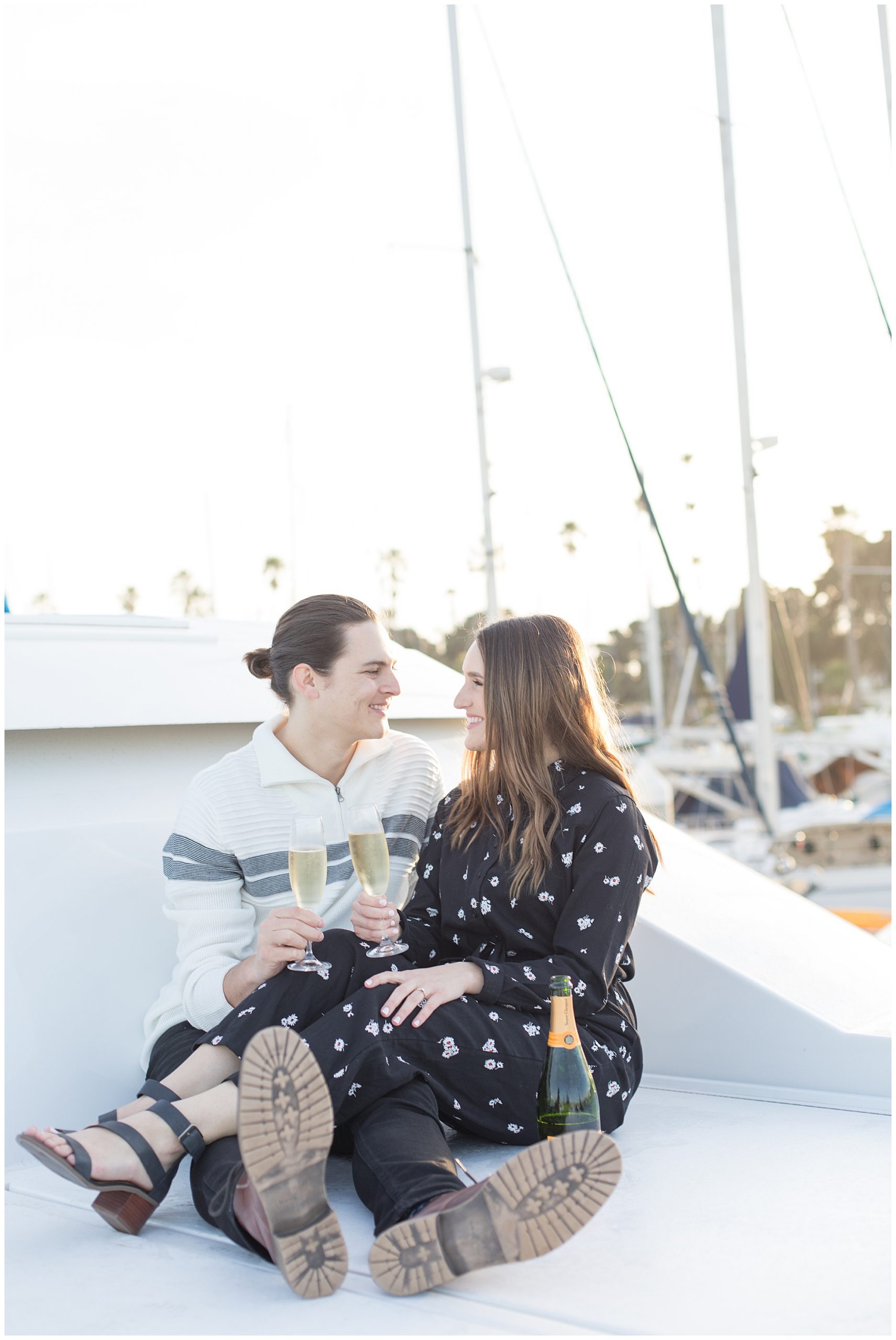 boat engagement photos with champagne