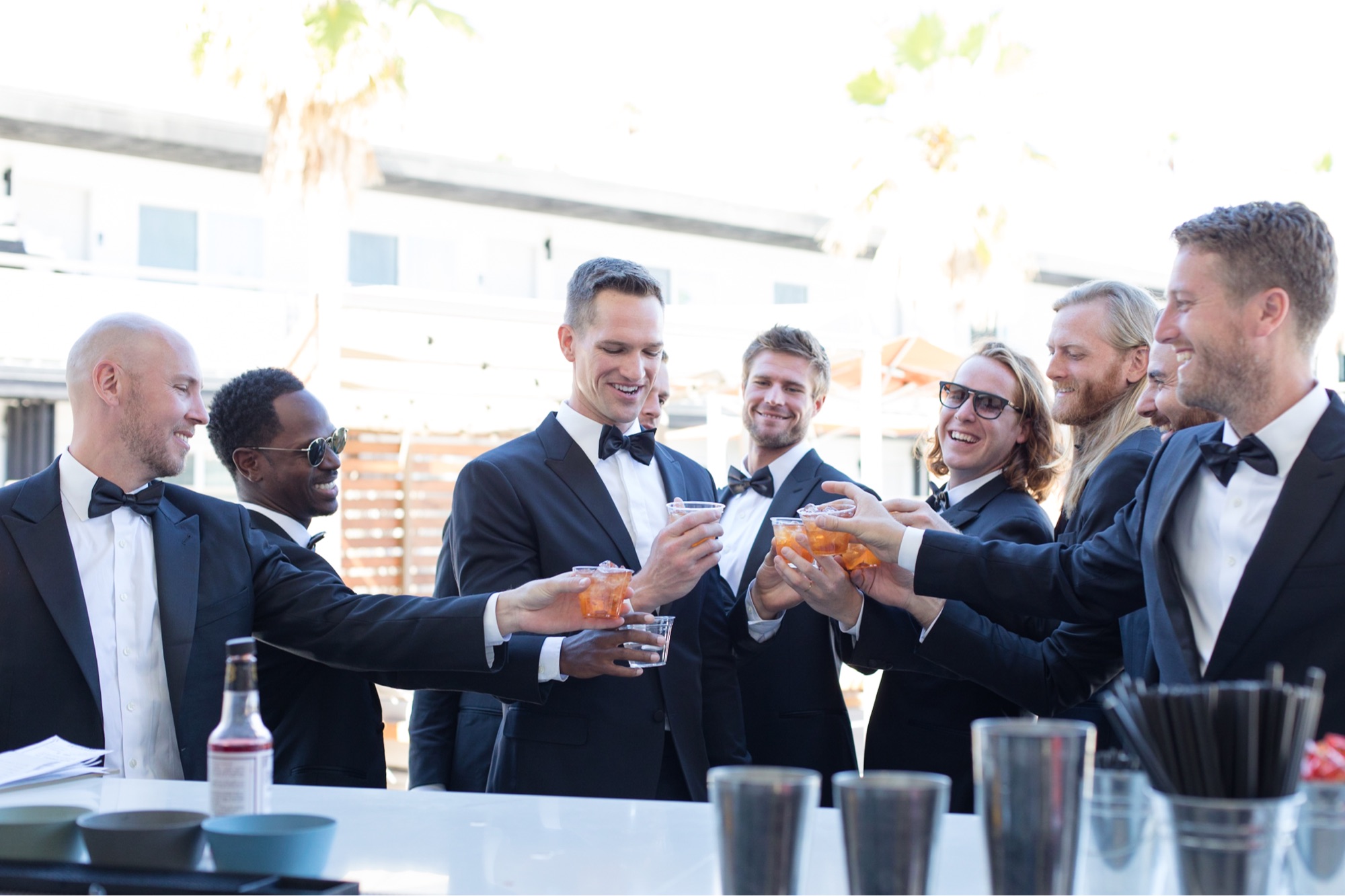 groomsmen drinking at bar