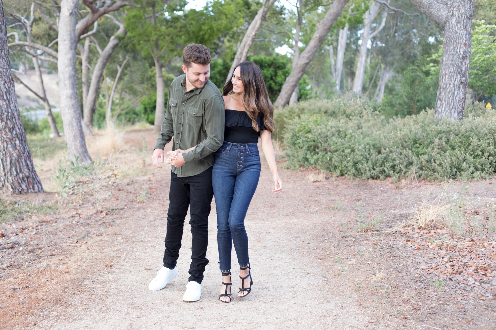 engaged couple walking on Palos Verdes trail