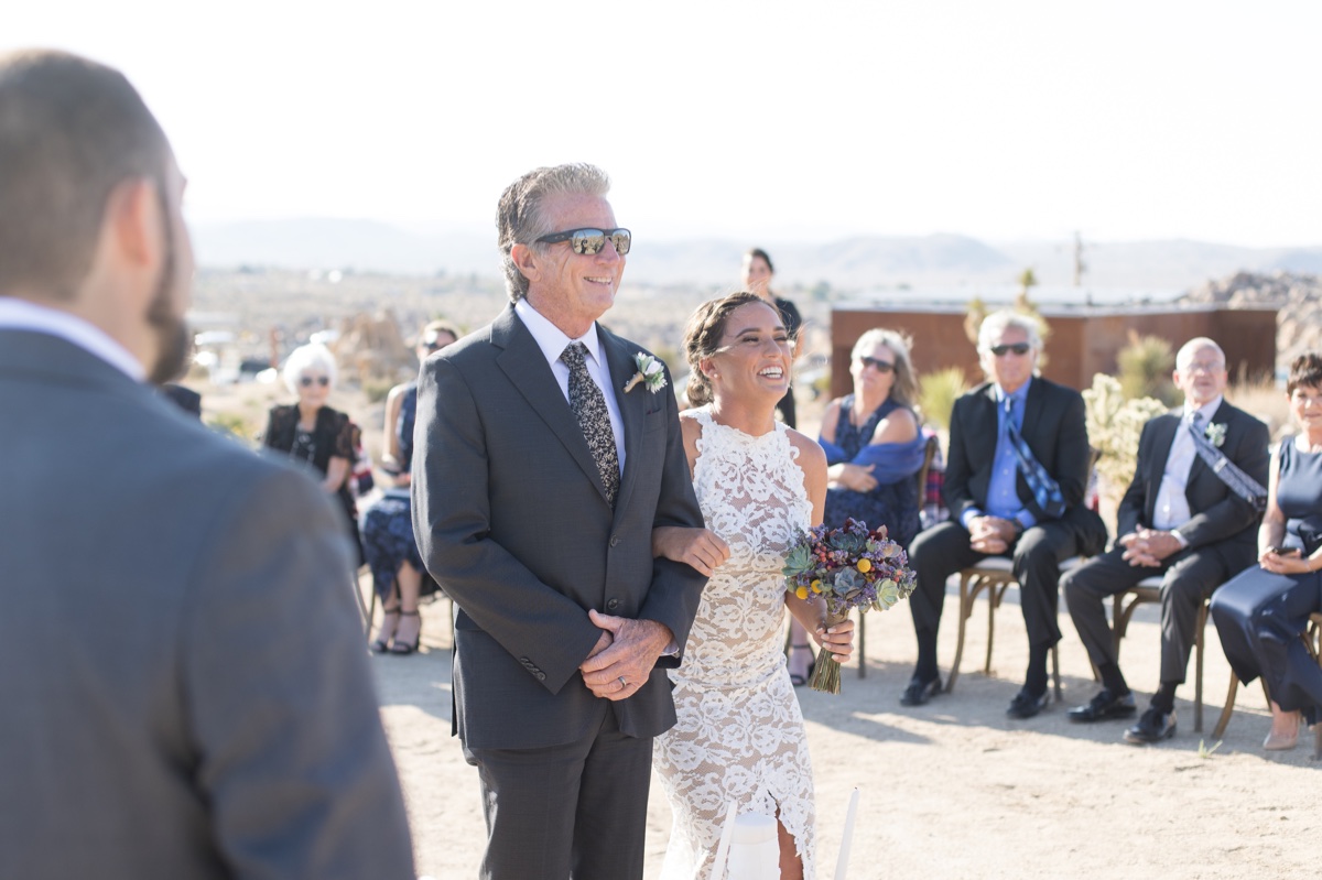 father walking bride down the aisle at joshua tree wedding ceremony