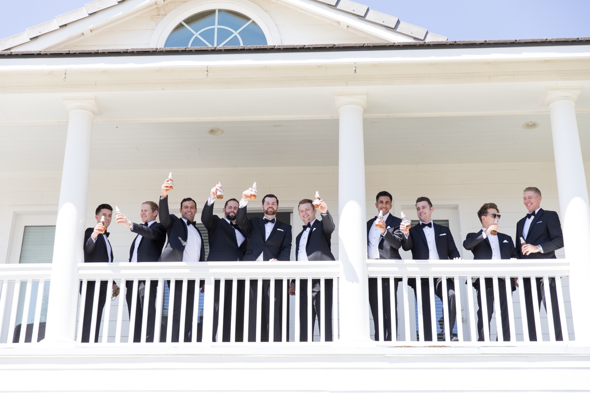 groomsmen getting ready and drinking before wedding