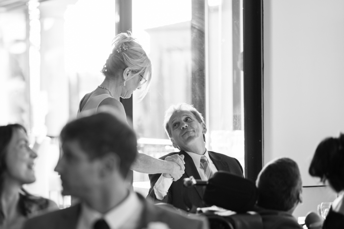 mother and father of the groom share a moment during wedding reception