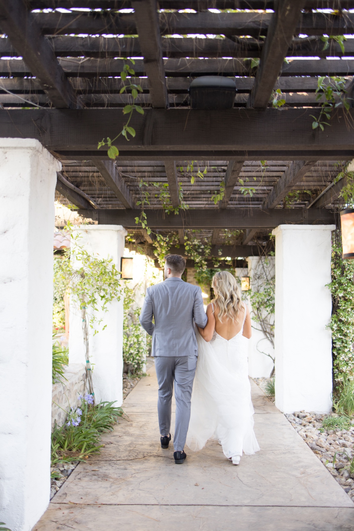 bride and groom walking to wedding reception