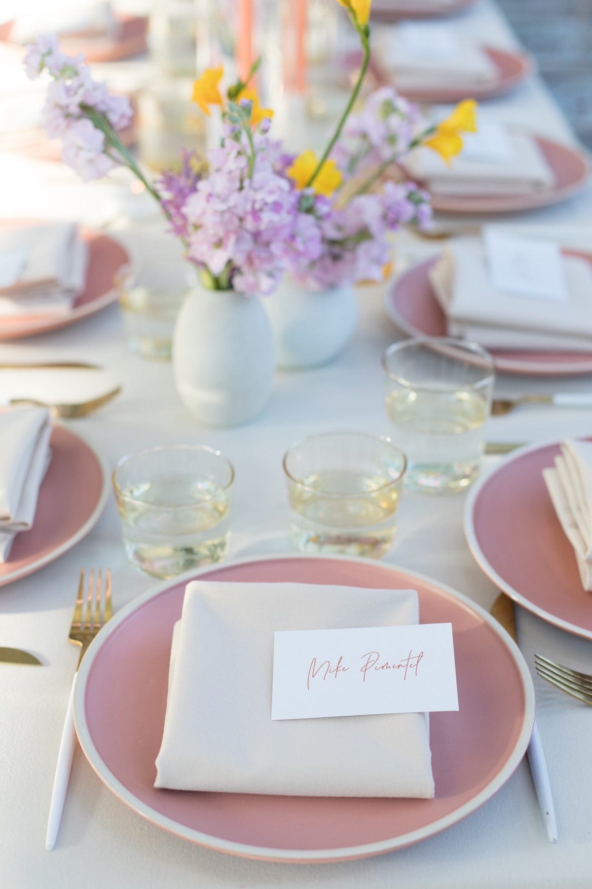 pink and white plates wedding reception