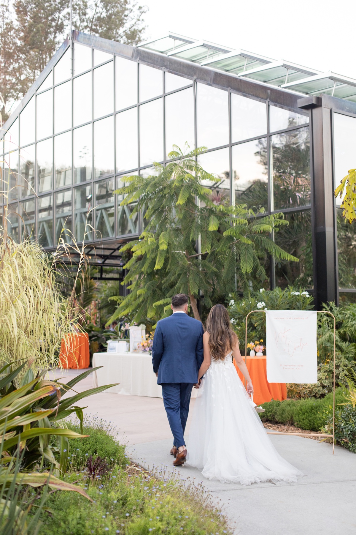 bride and groom entering their san diego wedding reception