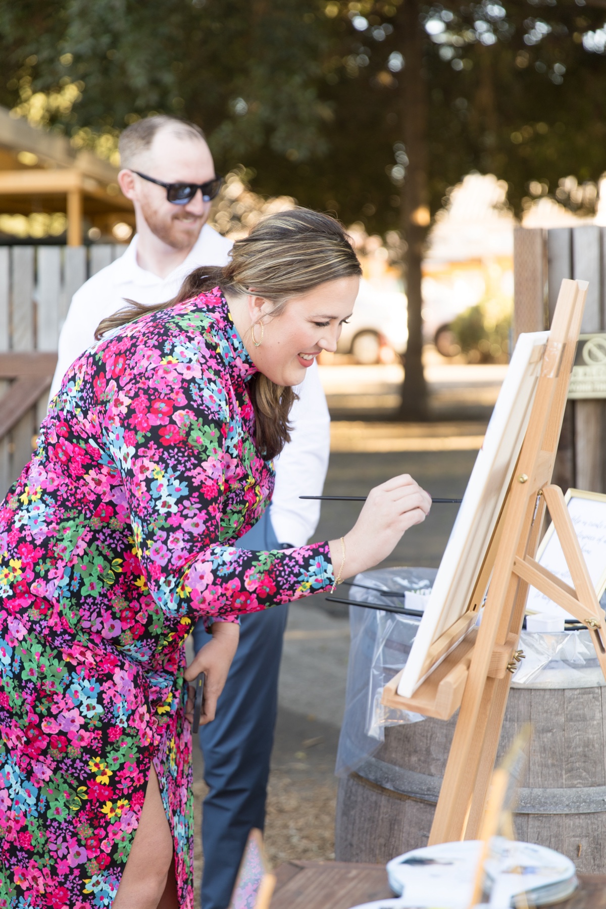 welcome sign painting a canvas at wedding