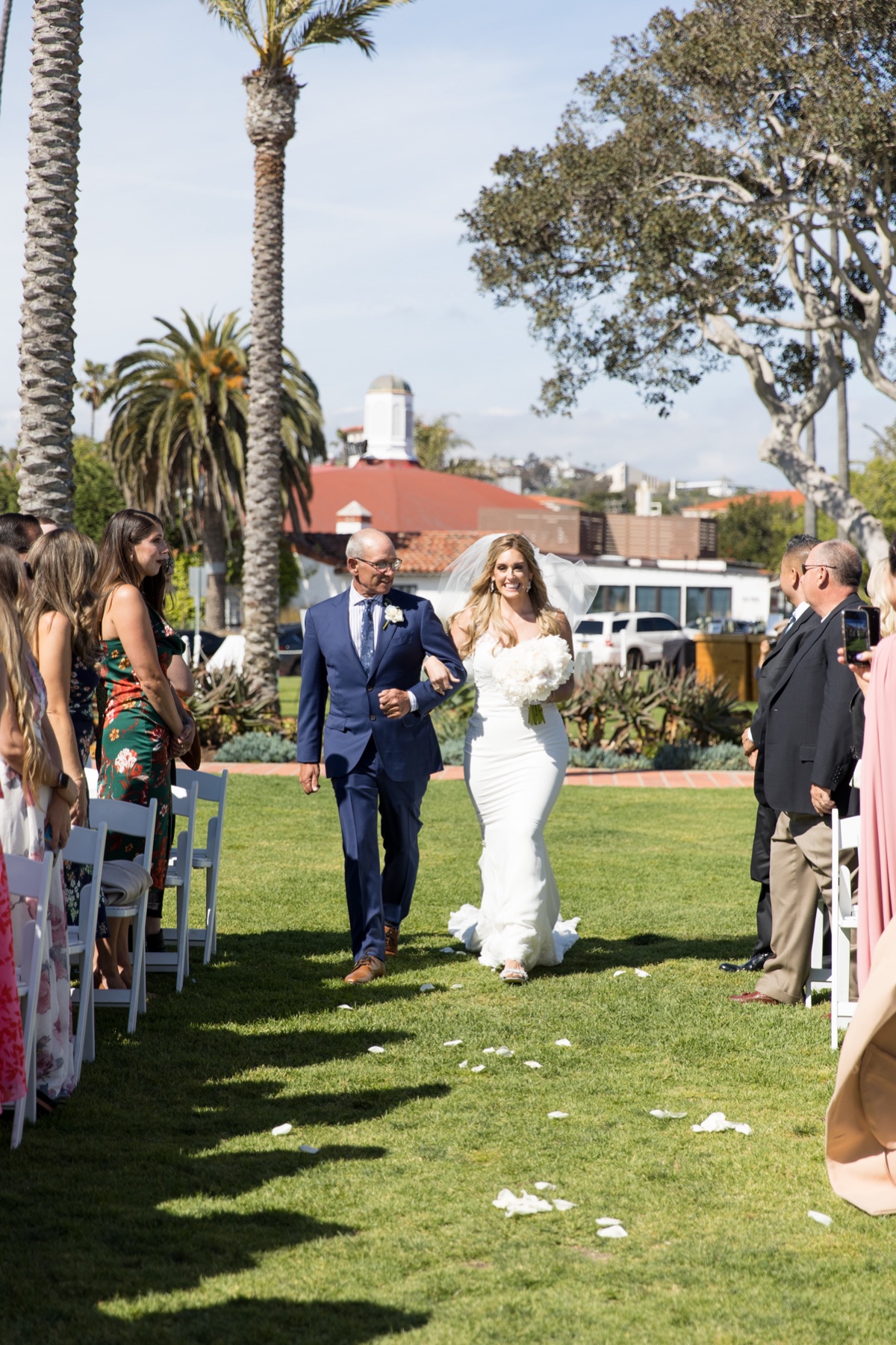 bride walking down the aisle for beach wedding 