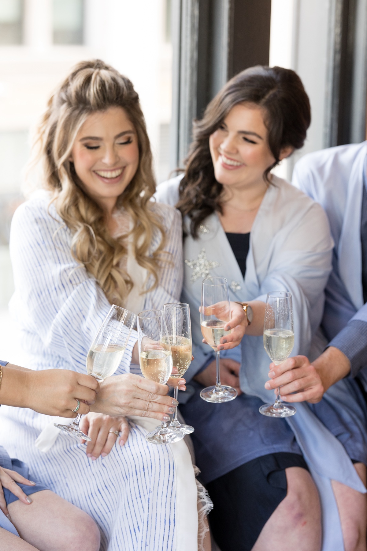 bridesmaids cheering on morning of wedding day 