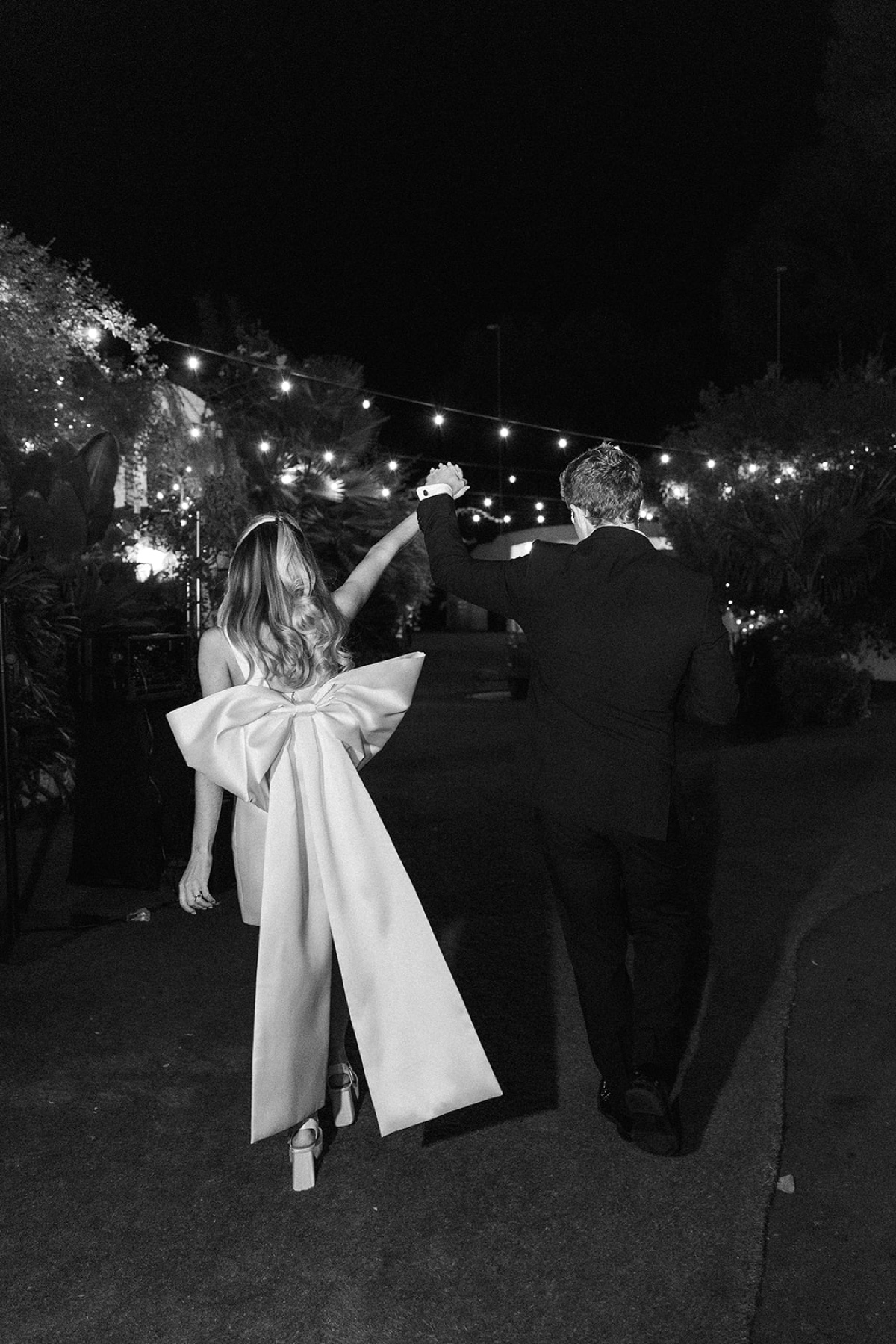 bride and groom walking into reception at their Tivoli Italian Villa Wedding