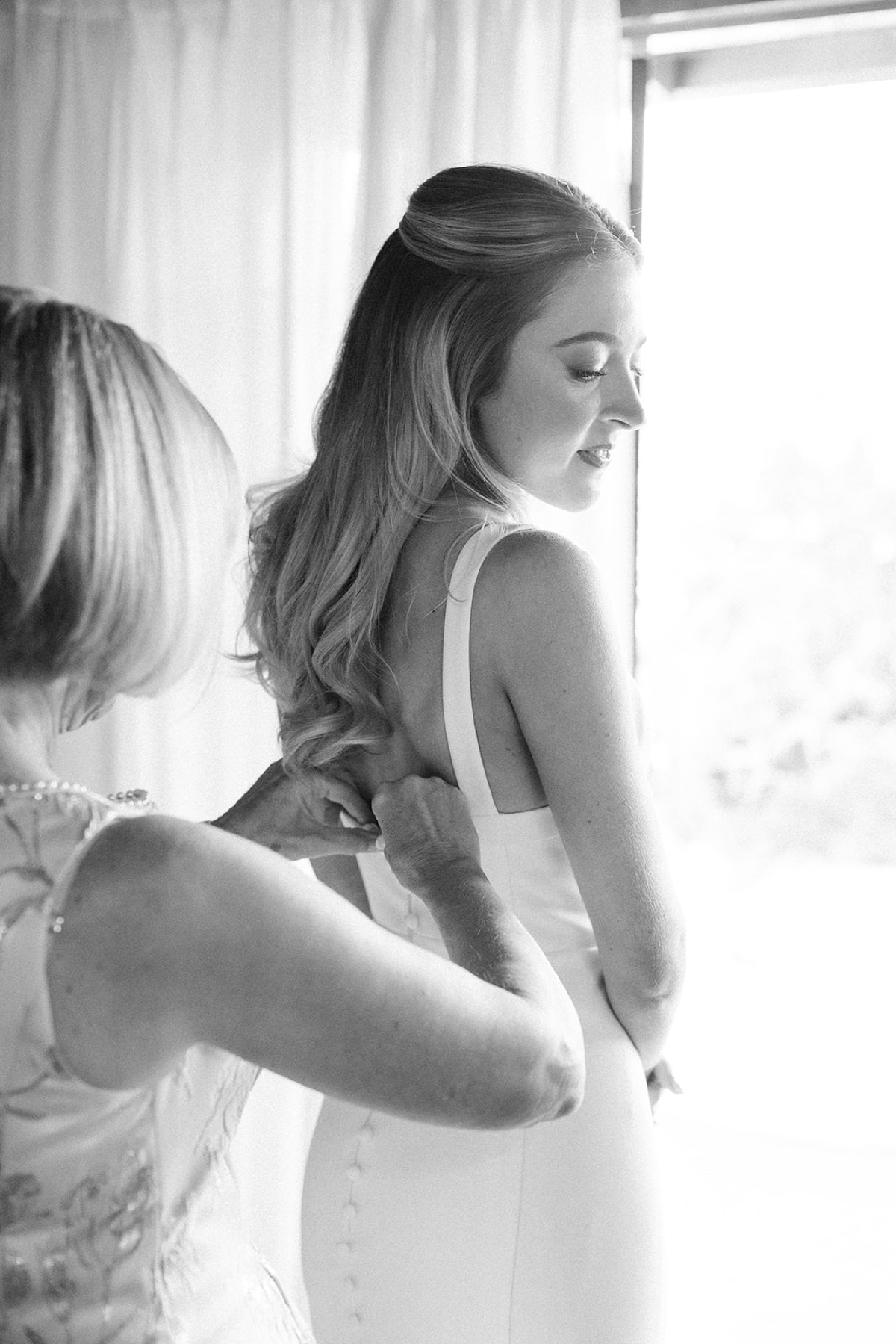 bride getting into her wedding dress at a temecula wedding venue