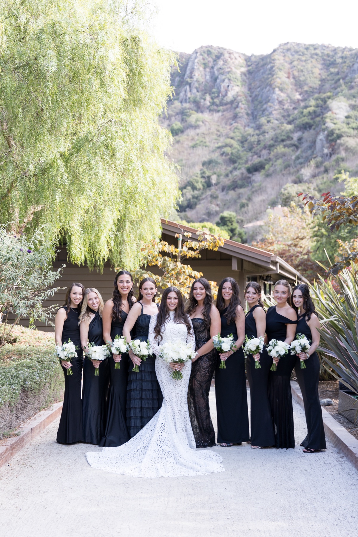Bridal party at Laguna Ranch with white florals, natural greenery, and candid group moments