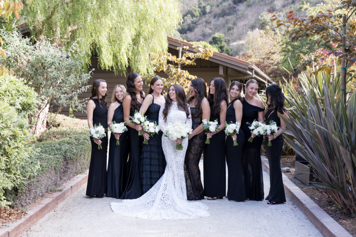 Bridal party at Laguna Ranch with white florals, natural greenery, and candid group moments