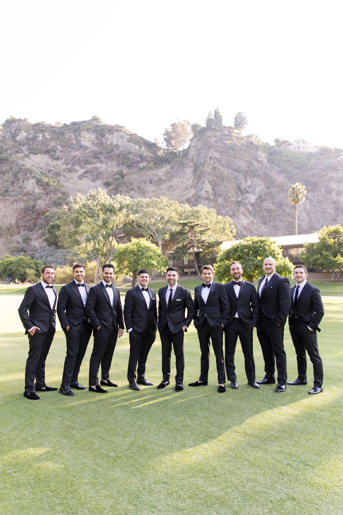 Bridal party at Laguna Ranch with white florals, natural greenery, and candid group moments