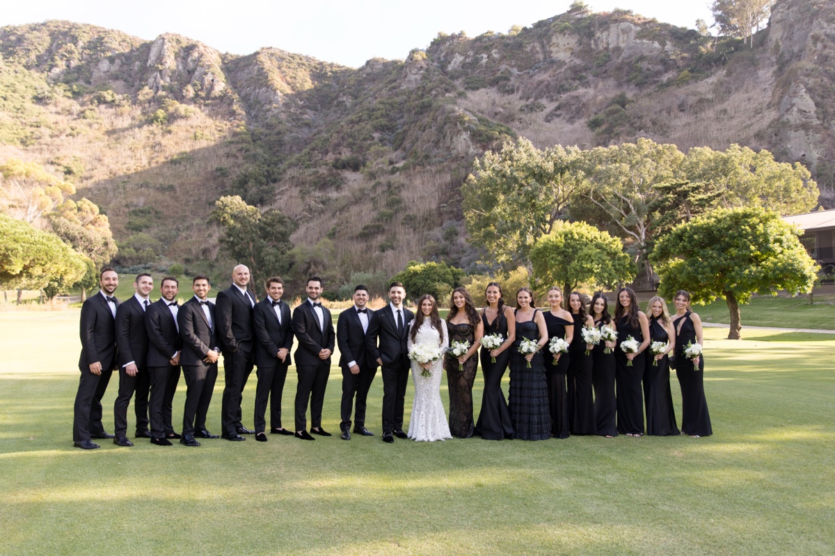 Bridal party at Laguna Ranch with white florals, natural greenery, and candid group moments