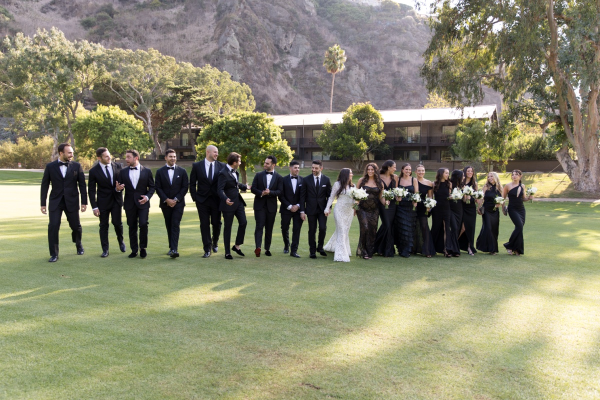 Bridal party at Laguna Ranch with white florals, natural greenery, and candid group moments