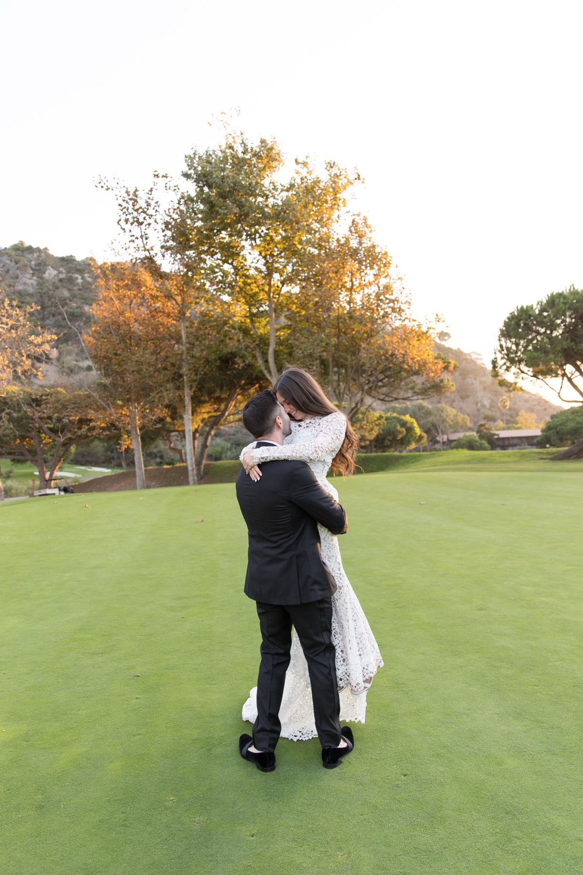 Bride and groom at golden hour during sunset portraits at the ranch at laguna beach