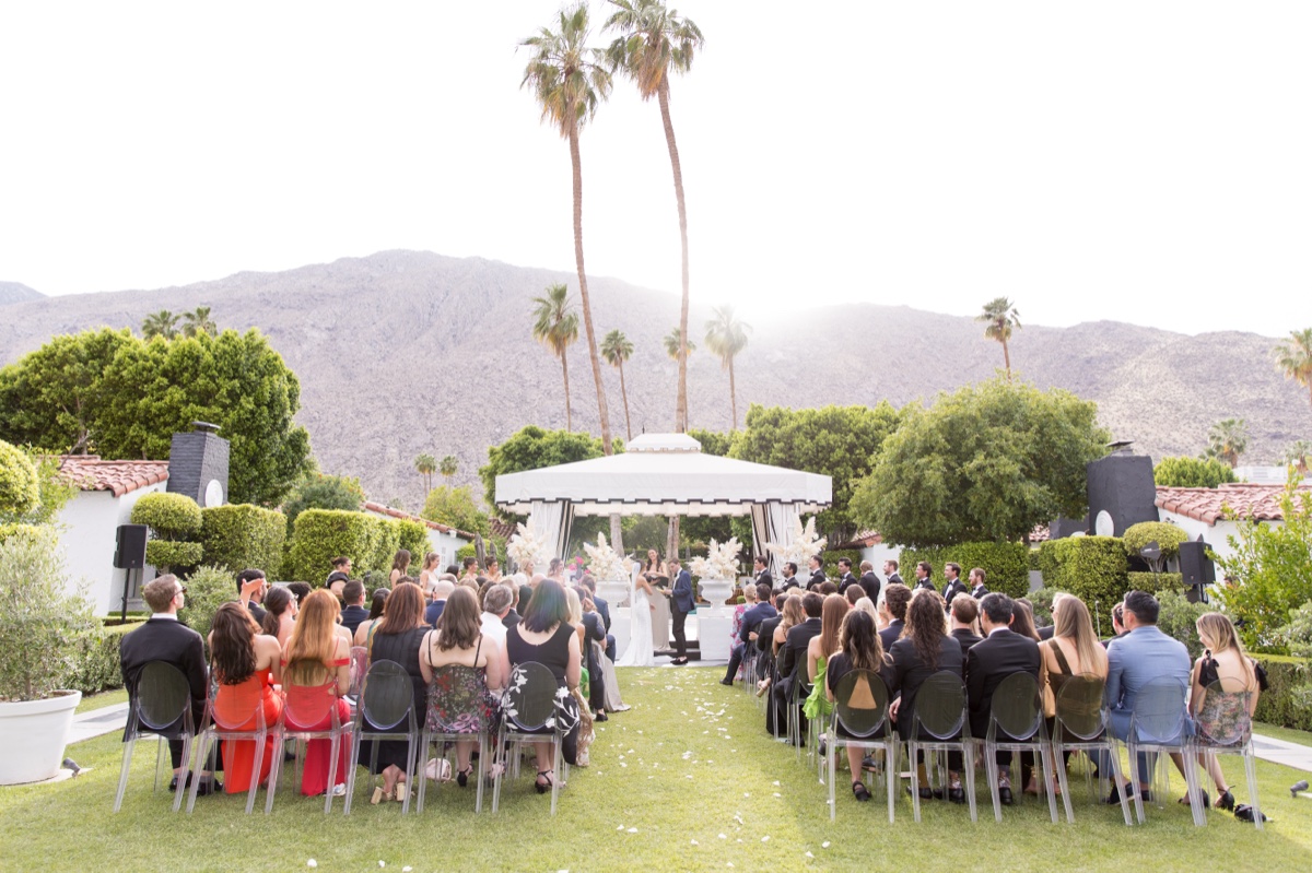 Bride and Groom exchanging vows at their Avalon Hotel Palm Springs wedding.