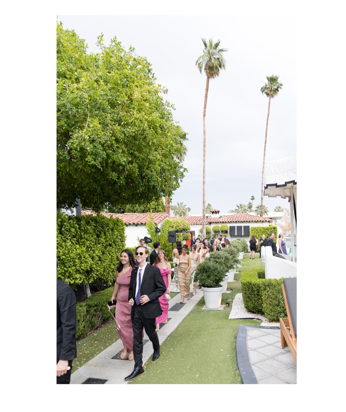 guests at the avalon hotel walking to the cocktail hour location.