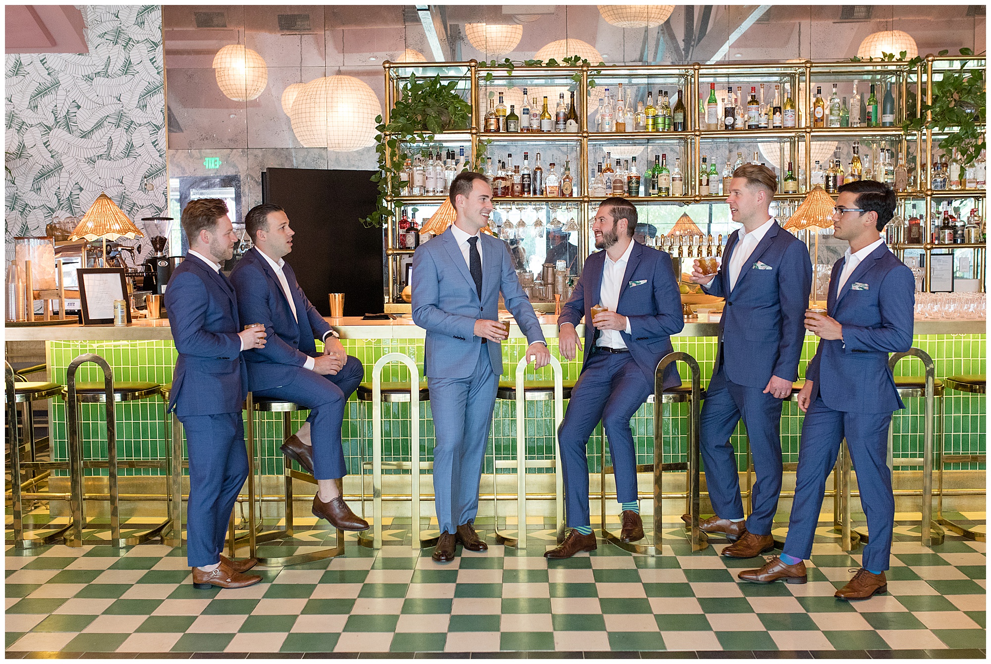 groomsmen drinking at pink cabana at sands hotel wedding