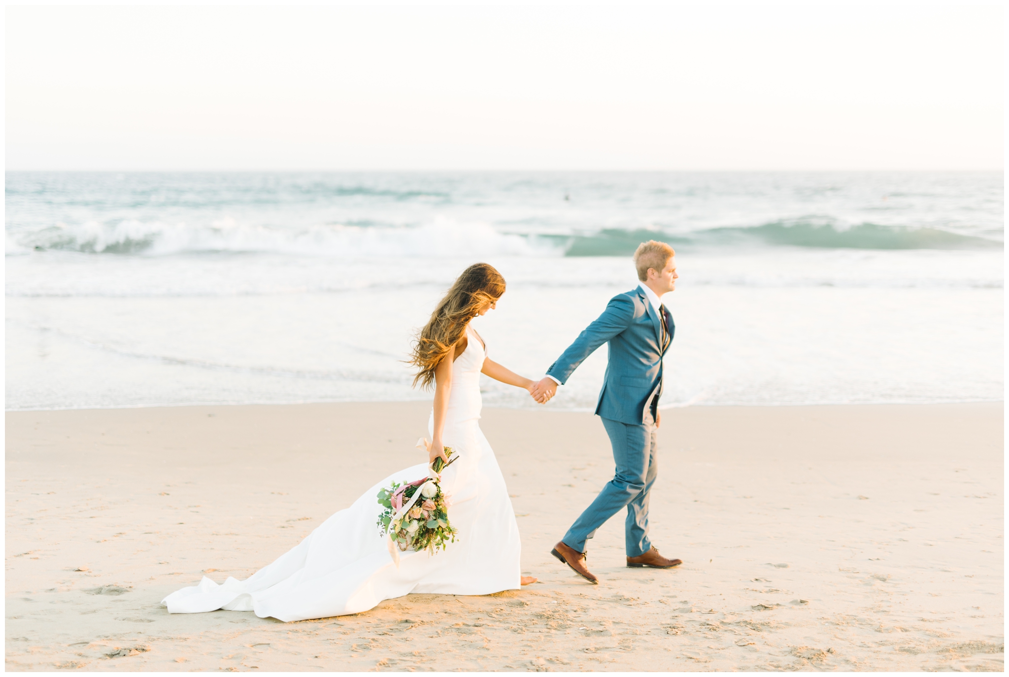 bride and groom walking on huntington beach in front of pasea hotel and spa