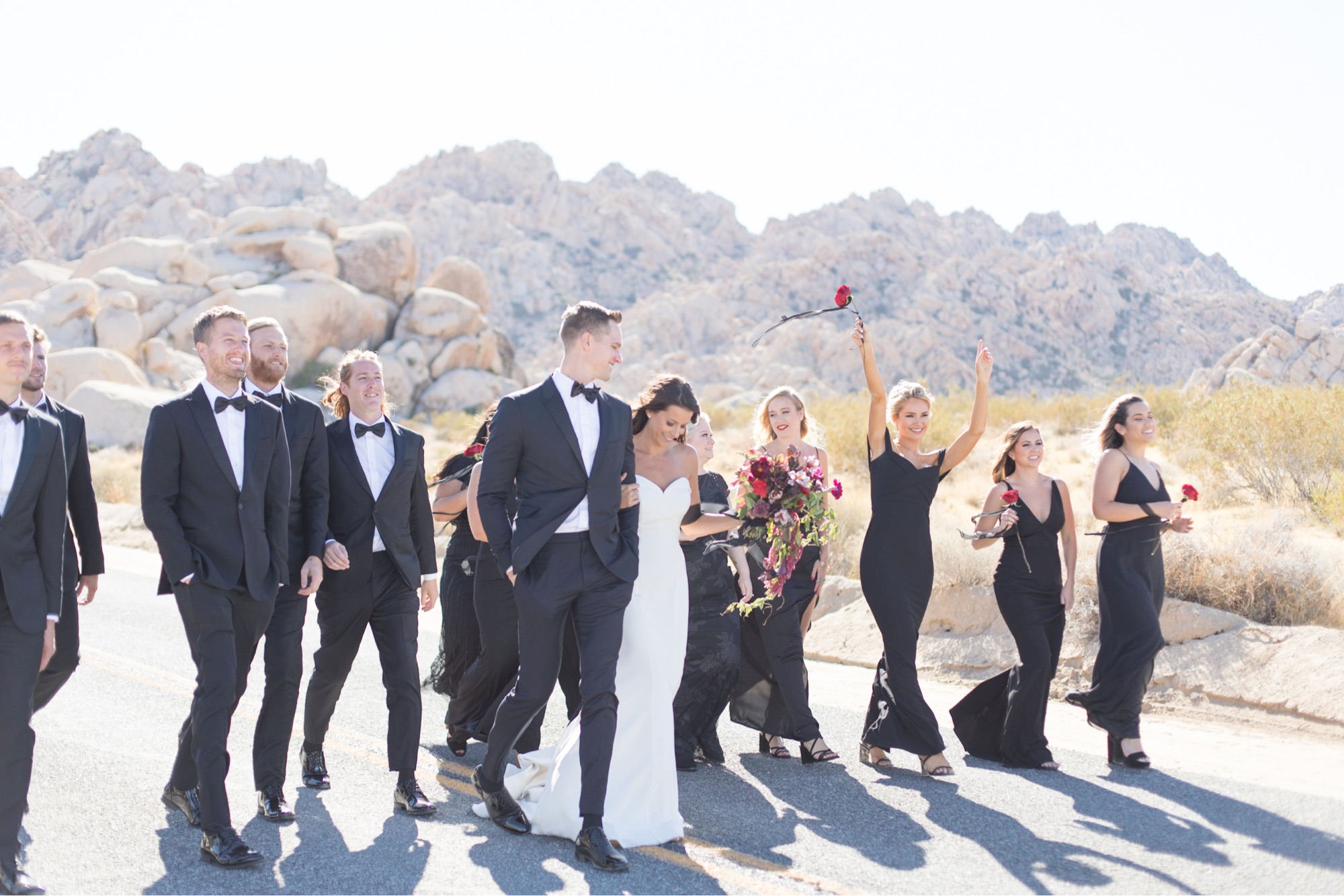 bridal party walking down road at joshua tree wedding